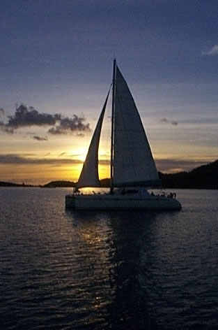 Sailboat with the setting Sun in the background